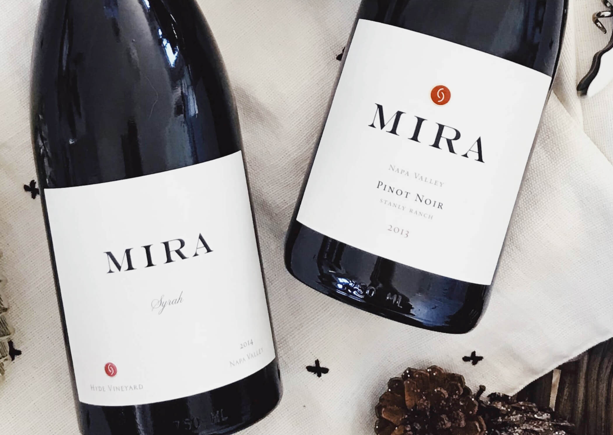 Bottles of Mira 2014 Syrah and 2013 Pinot Noir